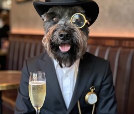 This time I gave it a bit more of a description and asked for him to be in a cafe, dressed smartly and added a pocket watch and some bubbly. Hamish in an AI generated image looking very dapper in a restaurant with a top hat, monocle and glass of bubbly.